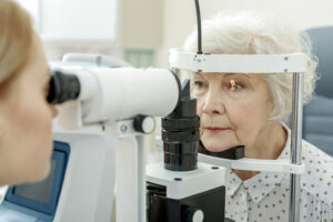 older woman receiving eye exam
