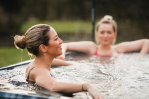 two women in hot tub 